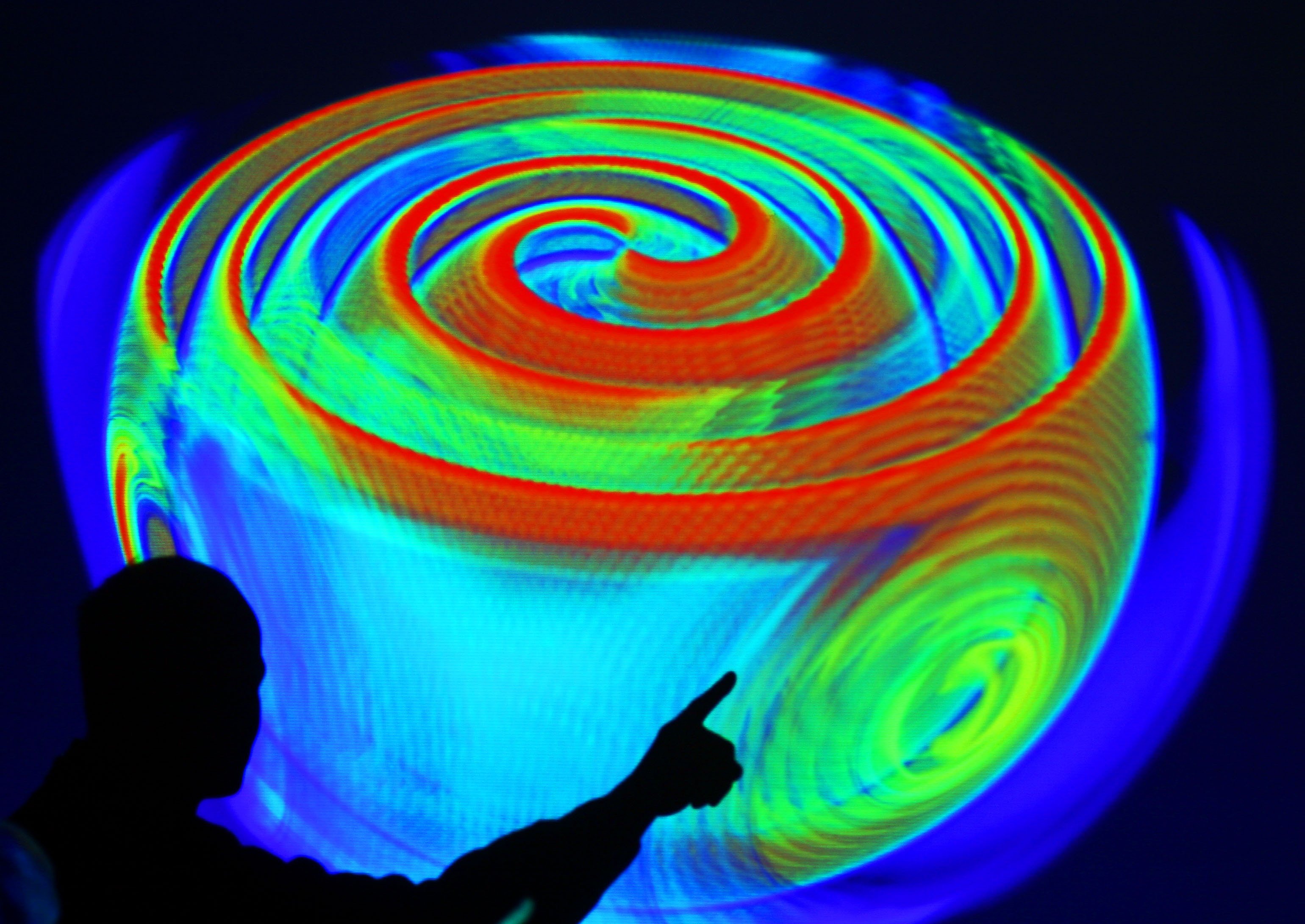 Gravitationswellen stauchen und strecken den Raum, wie Wellen auf der Wasseroberfläche. (dpa)  Gravitationswellen stauchen und strecken den Raum, wie Wellen auf der Wasseroberfläche. (dpa)
