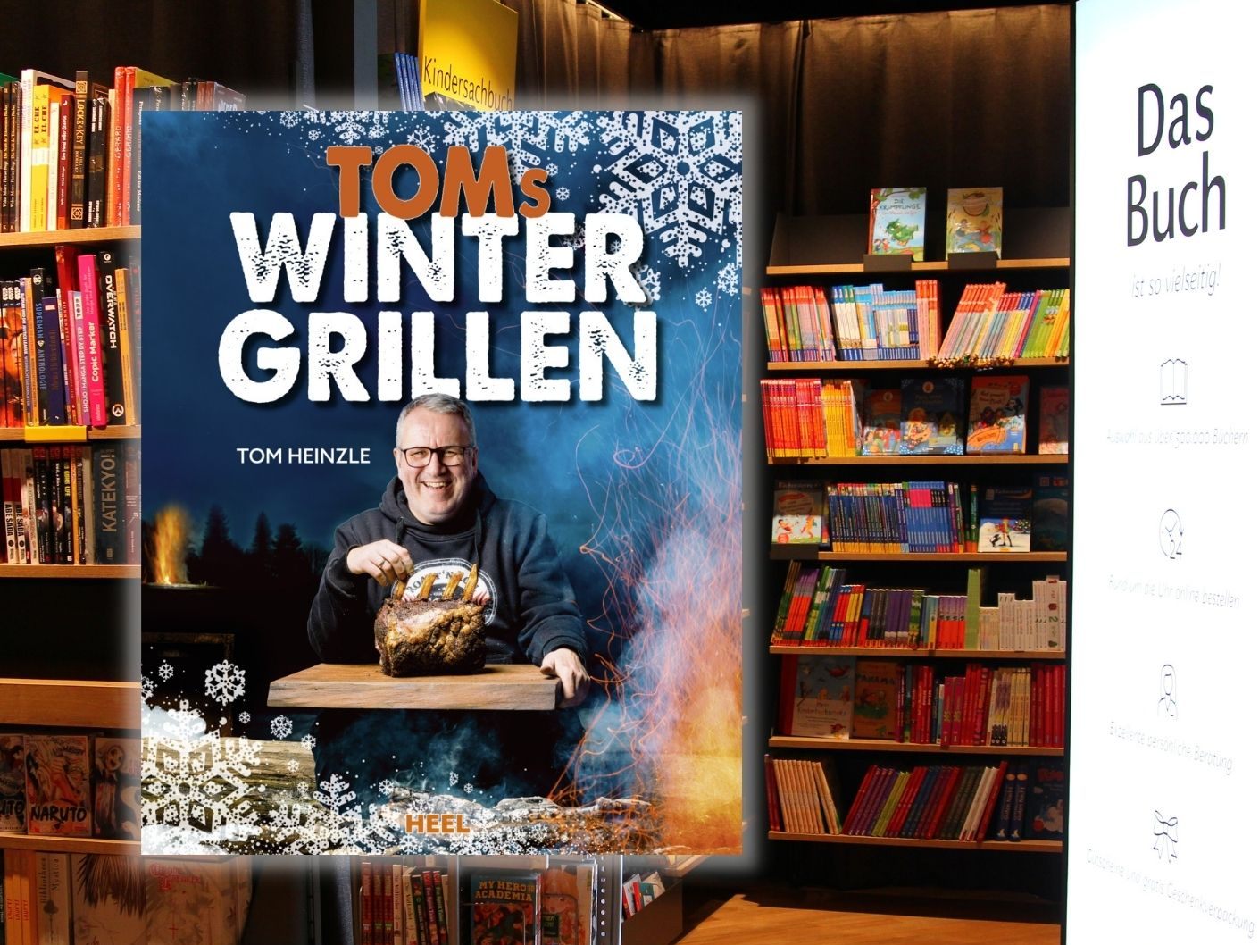 "Toms Wintergrillen" und die Buchhandlung "Das Buch" im Hintergrund.