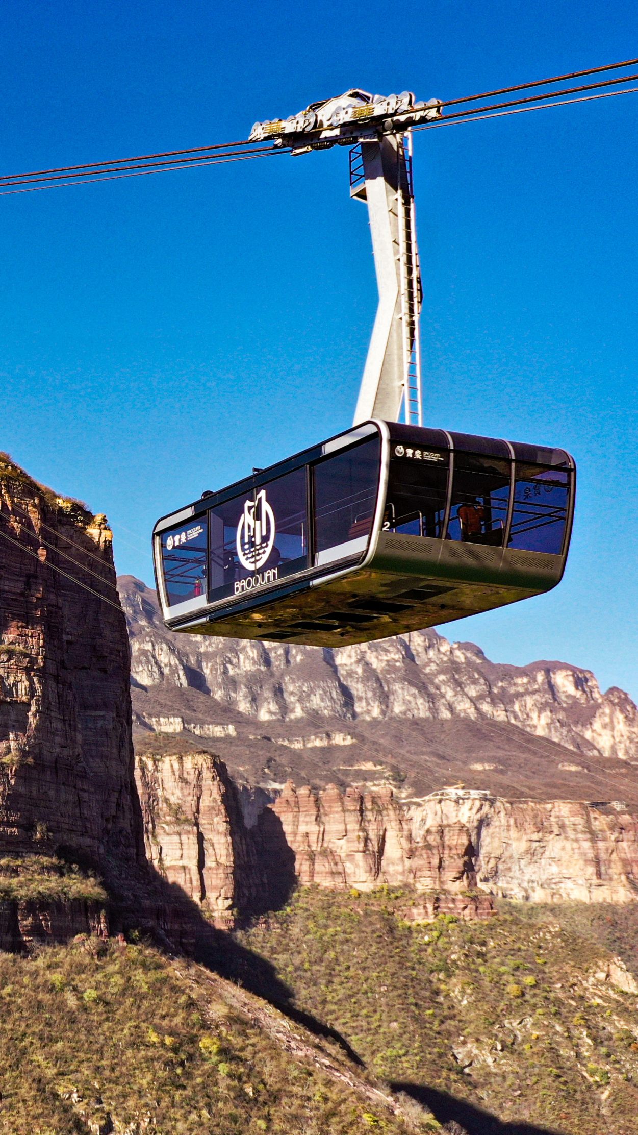Seit Dezember befördert die größte Pendelbahn Chinas Besucher auf die Anhöhe Baoquan.