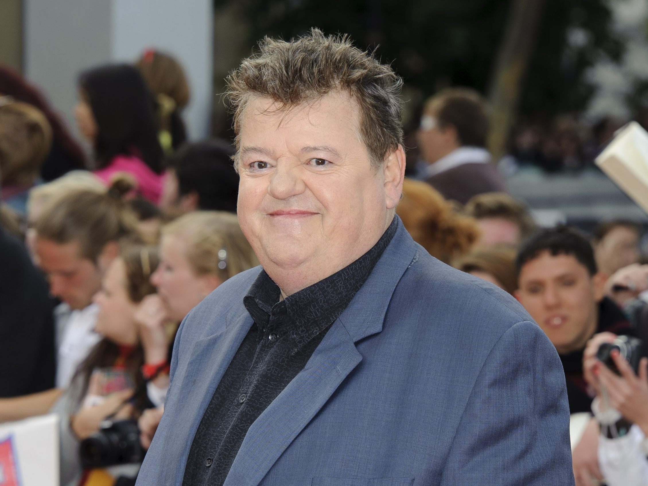 Mit diesen Tricks wurde Robbie Coltrane alias "Hagrid" im Film größer geschummelt.